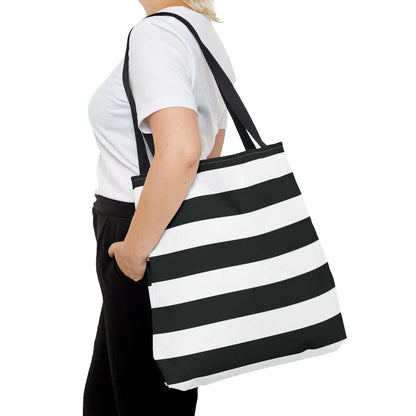 Black and white shoulder tote bag with canvas striped design and black fabric handles for beach or grocery use