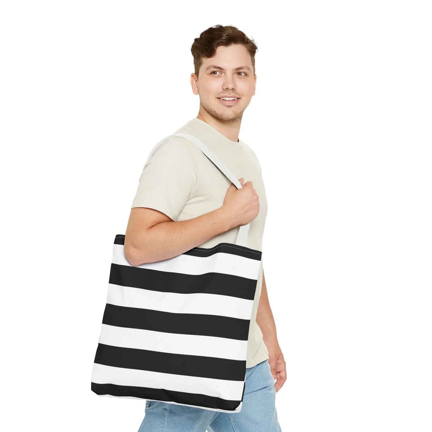 Black and white shoulder tote bag with canvas material and horizontal stripes ideal as a stylish grocery or beach tote