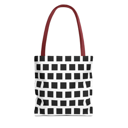 White tote bag with bold black square pattern and red fabric handles versatile and durable shoulder bag