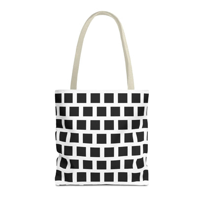 White canvas tote bag with black square pattern and cream-colored handles for versatile durable use