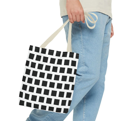 Black and white canvas tote bag with black square pattern and matching handles for versatile shoulder use