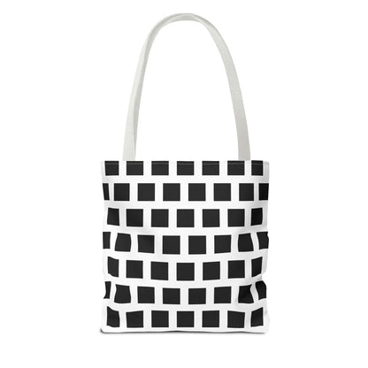 White canvas tote bag with black square pattern and matching white handles for versatile shoulder use