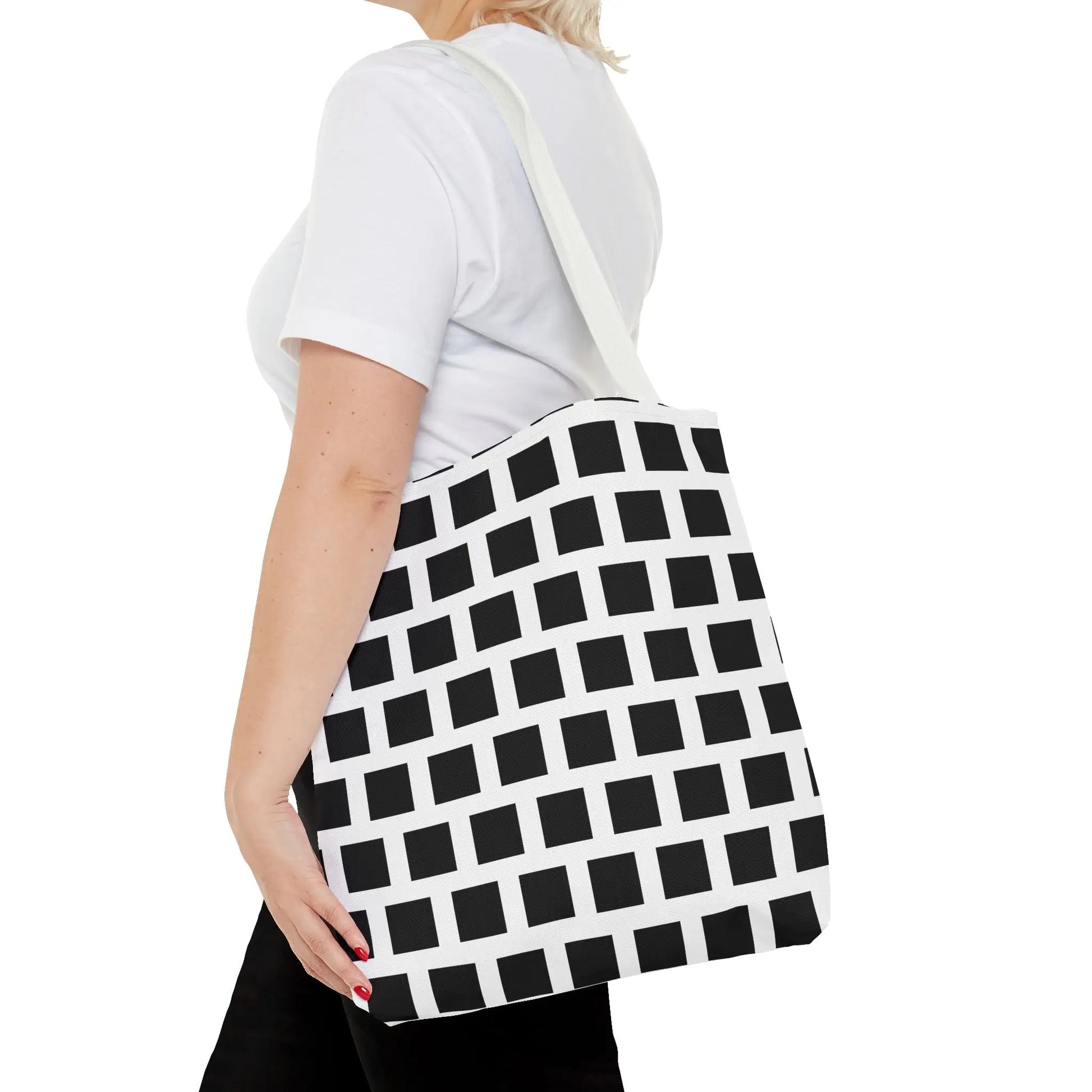 White durable fabric tote bag with black square pattern and single shoulder strap for versatile everyday use