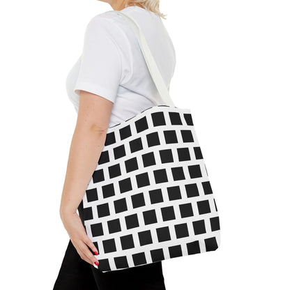 White durable fabric tote bag with black square pattern and single shoulder strap for versatile everyday use