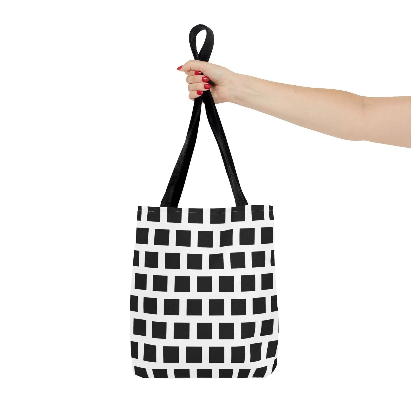 Black and white canvas tote bag with black square pattern and black fabric handles for versatile daily use