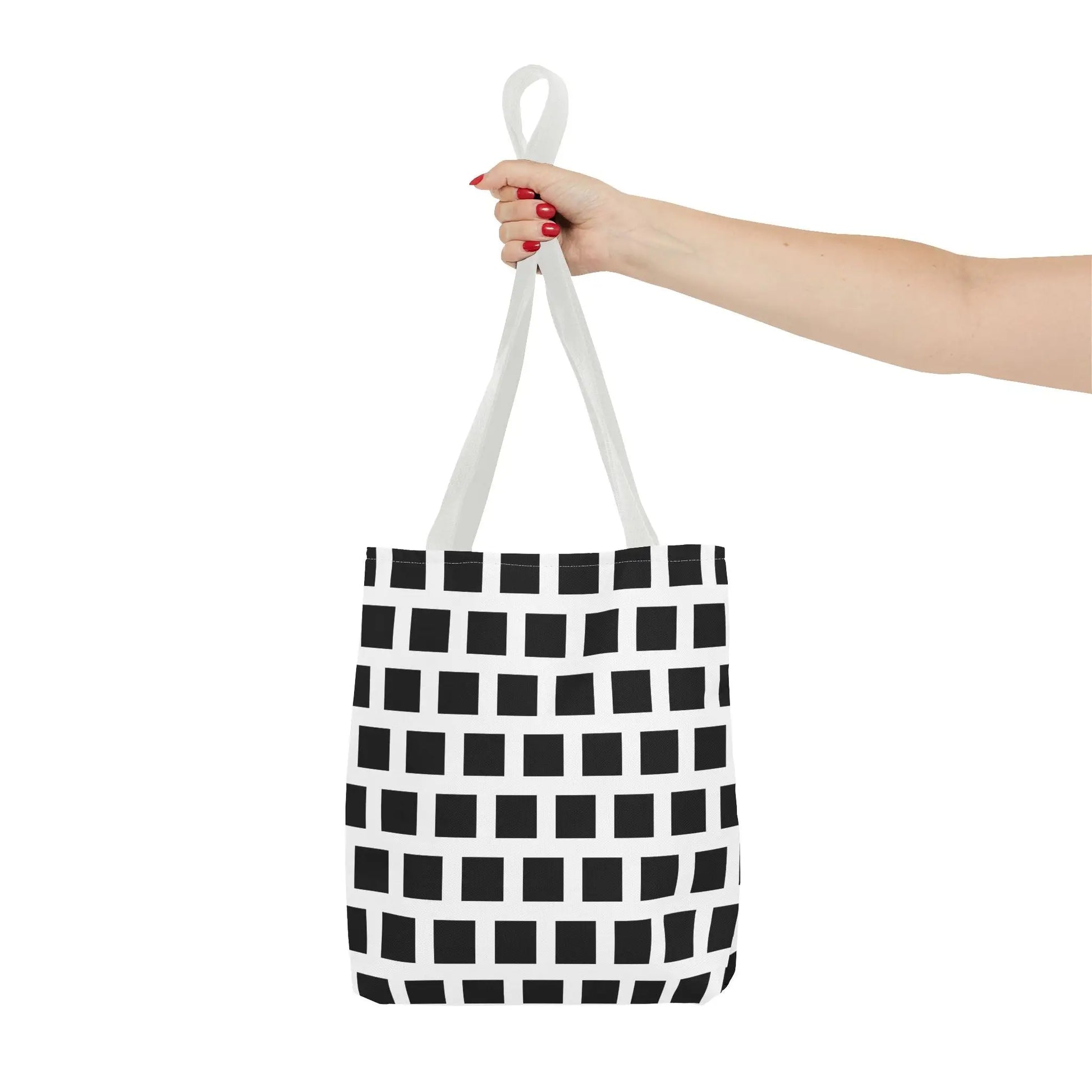 White canvas tote bag with black square pattern and matching white handles versatile and durable shoulder bag