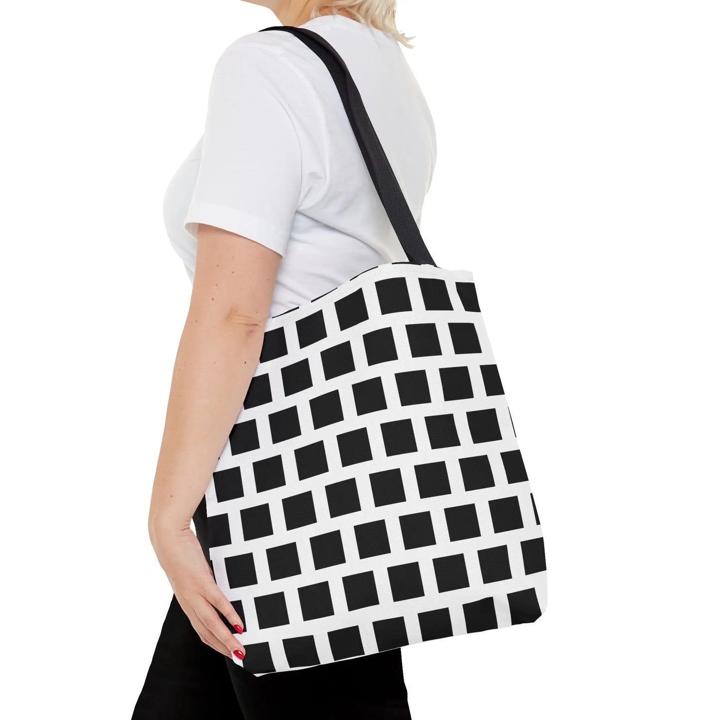 Black and white canvas tote bag with black square pattern and single shoulder strap, versatile and durable design