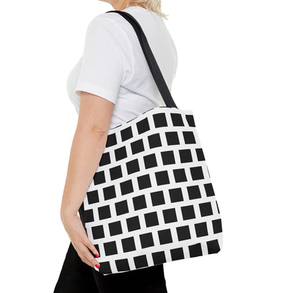Black and white canvas tote bag with black square pattern and single shoulder strap, versatile and durable design