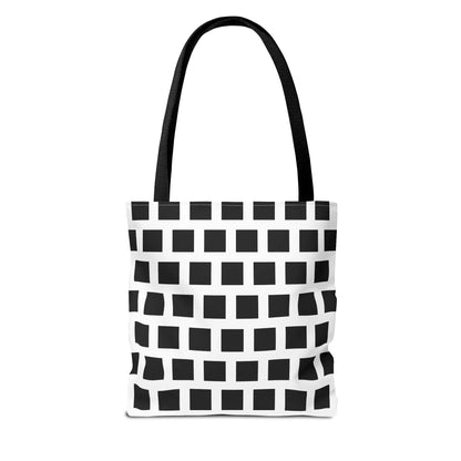 Black and white woven fabric tote bag with black square pattern and sturdy straps for versatile shoulder use