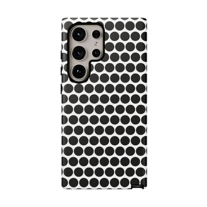 Black white dot pattern tough phone case with sleek modern design shown from back for iphone samsung google