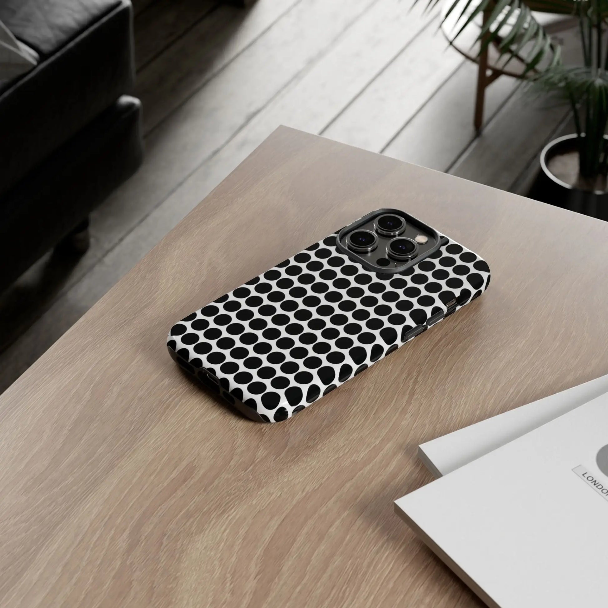 Black white dot pattern tough phone case showing back side with sleek modern design for iphone samsung google