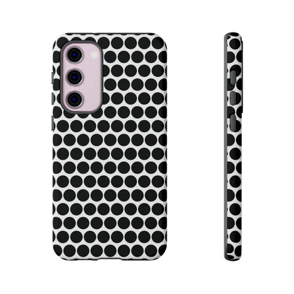 Black white dot pattern tough phone case with sleek modern design shown from the back for iphone samsung google