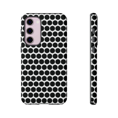 Black white dot pattern tough phone case with sleek modern design shown from the back for iphone samsung and google