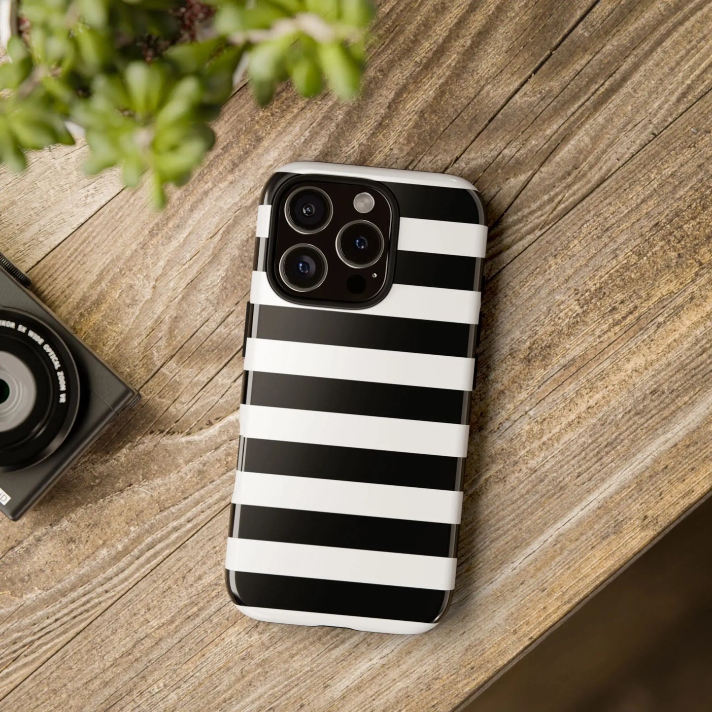 Back side of a black white stripe glossy phone case for iphone 13 pro designed as a white stripe phone case