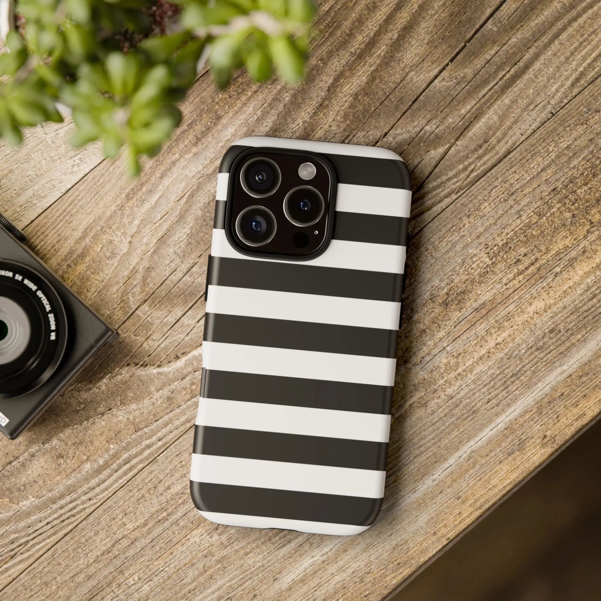 Black white stripe phone case for iphone samsung and google pixel with sleek modern design shown from the back side