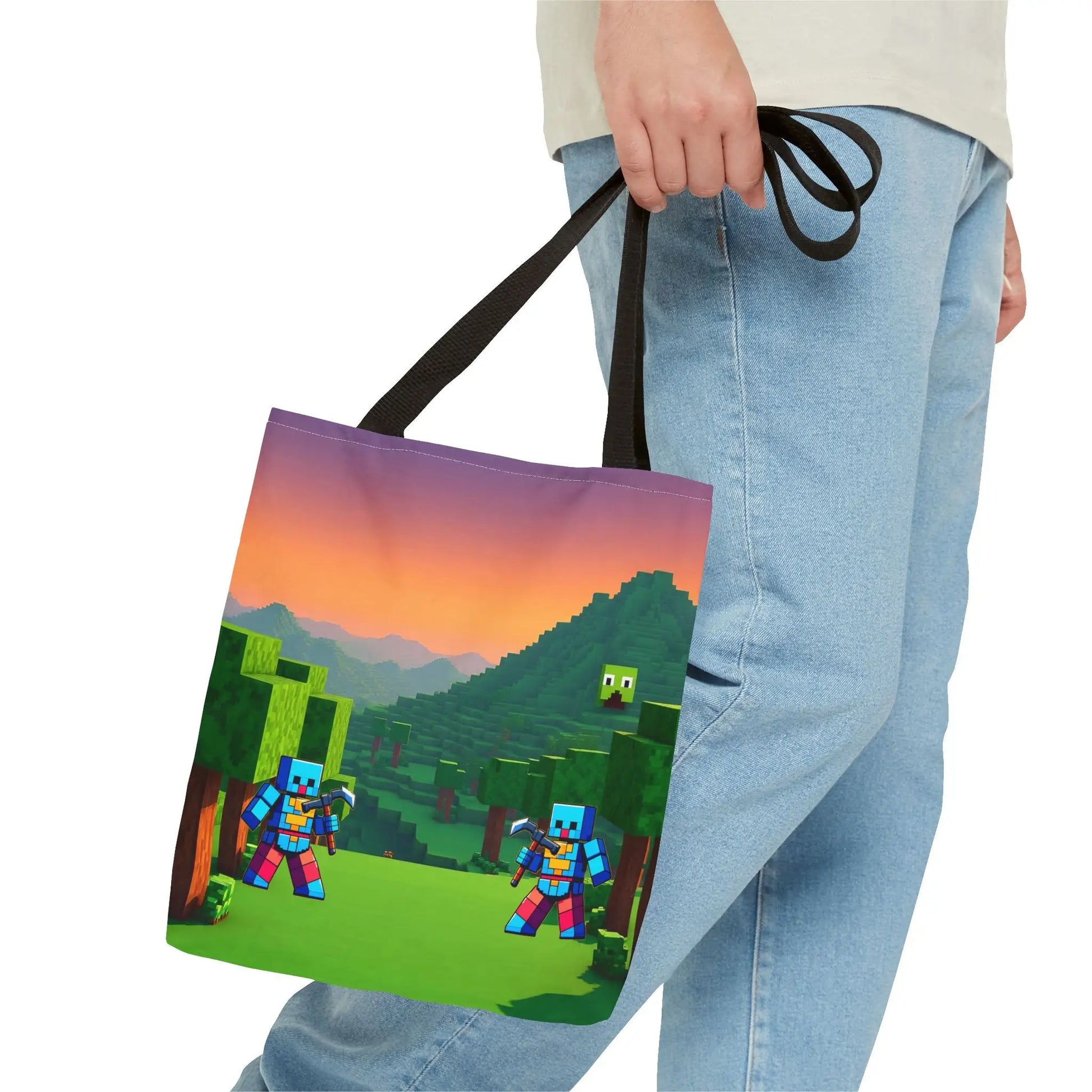 A minecraft inspired blocks tote bag for kids with pixelated characters, sunset landscape, and black fabric handles