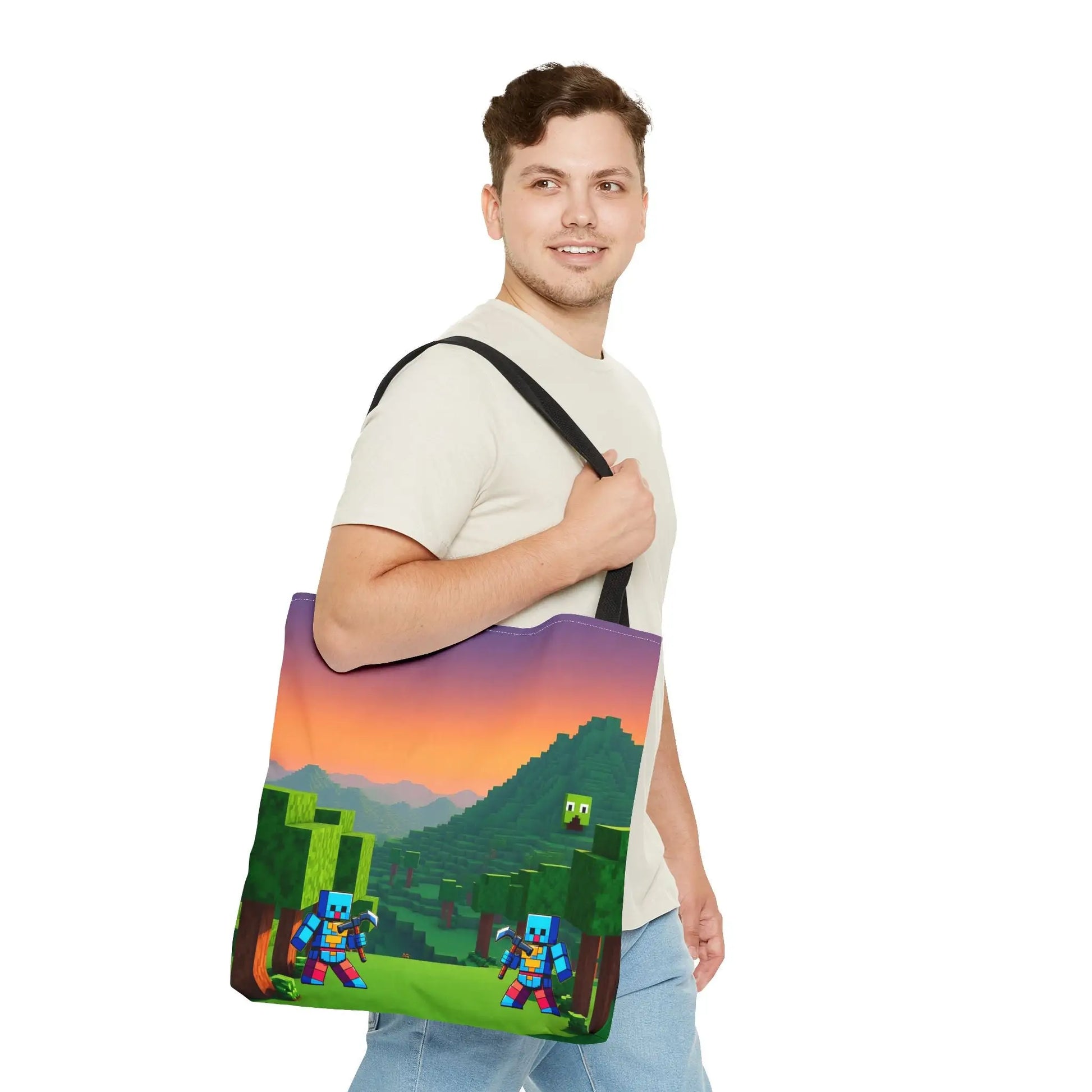 A minecraft inspired blocks tote bag for kids featuring pixelated characters and sunset landscape with black straps