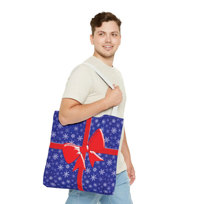 Blue christmas tote bag with white snowflake pattern and red bow for festive holiday shopping and reusable use
