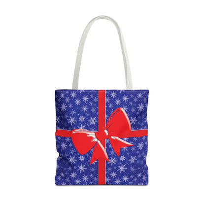 Blue christmas tote bag with white snowflake pattern and red bow for festive reusable holiday shopping with white red blue handles