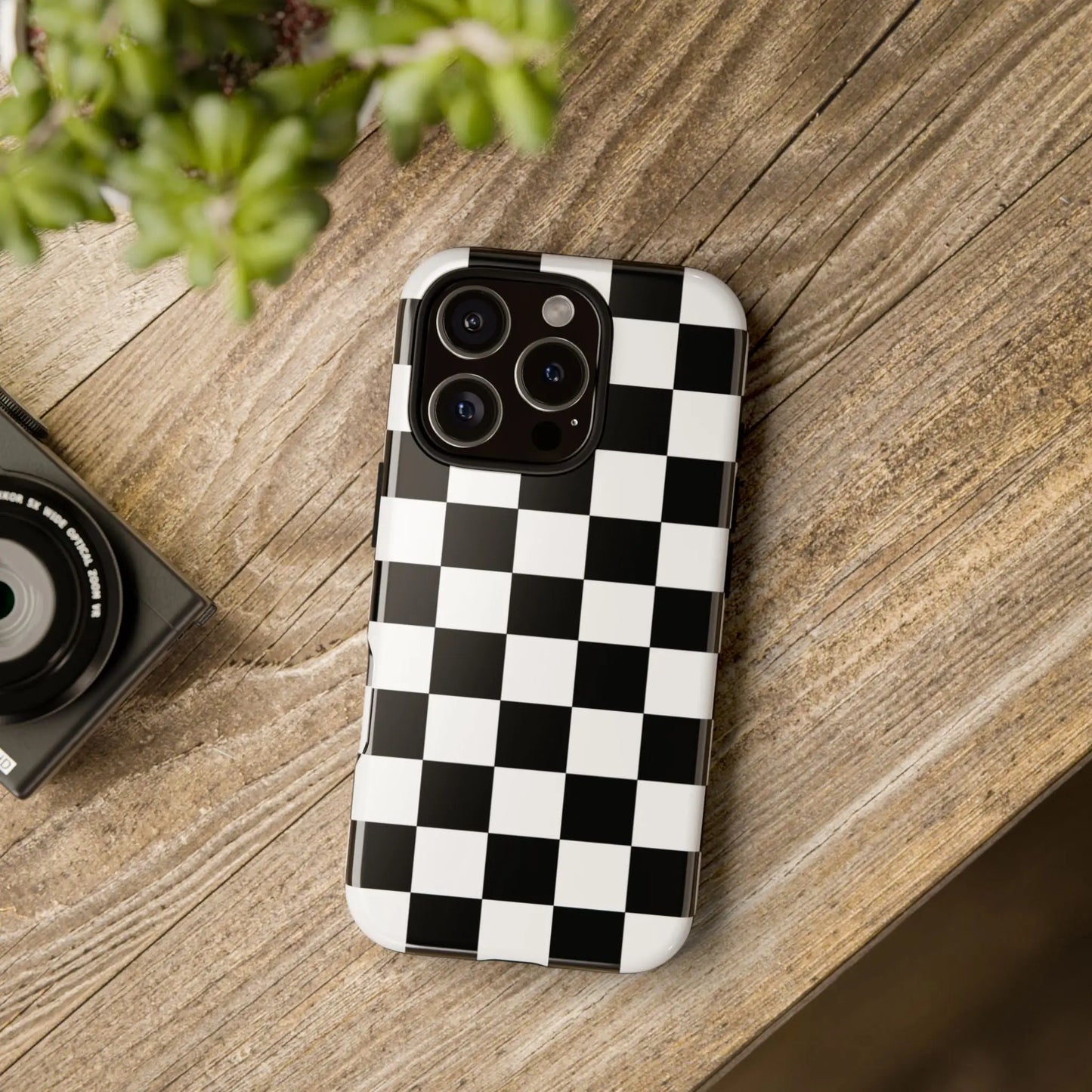 Black and white checkered flag phone case with glossy finish showing back side for iPhone protection