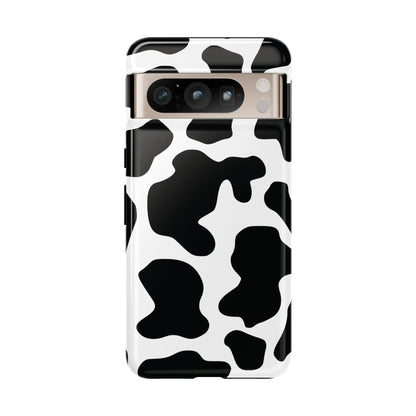 Black cow print protective phone case showing the back side with a white and black cow pattern design
