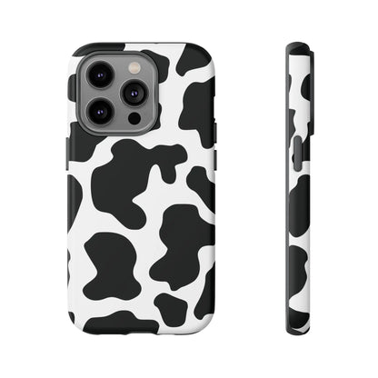 Black cow print protective phone case showing the back side with a classic black and white cow print pattern