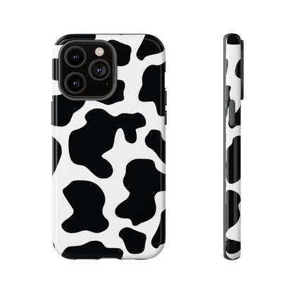 Back side of sleek black cow print phone case with protective design featuring a black and white cow pattern