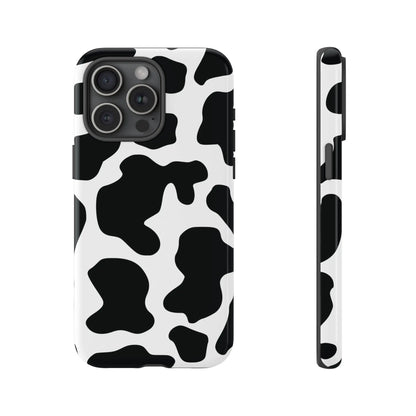 Black cow print phone case showing the back side of a protective cow print phone cover with black and white spots
