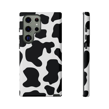 Black cow print phone case showing the back side with a protective cover and classic cow print design
