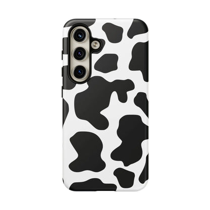 Black cow print phone case showing the back side with protective cow print phone cover design in black and white