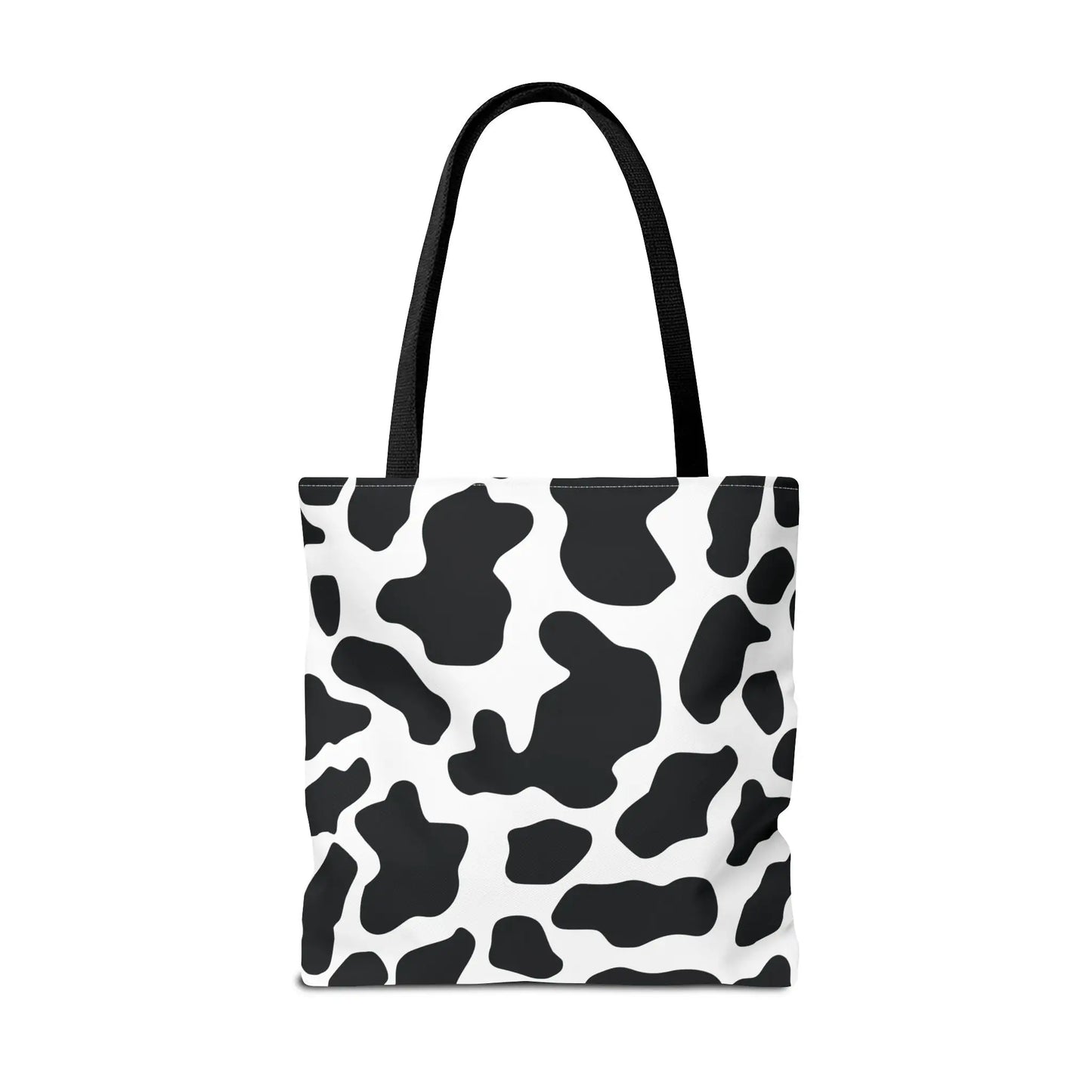 Black and white cow print tote bag with black fabric handles large reusable shopping and travel bag