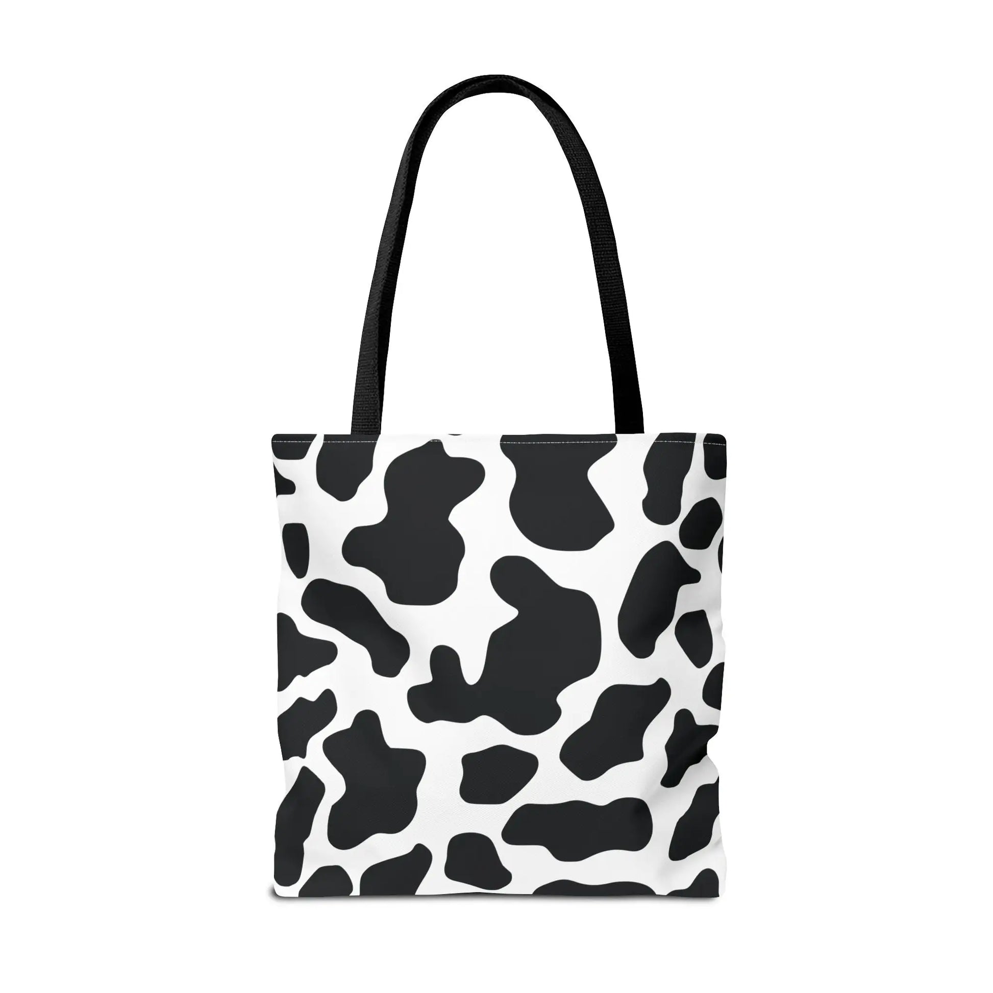 Black and white cow print tote bag with black fabric handles large reusable shopping and travel bag