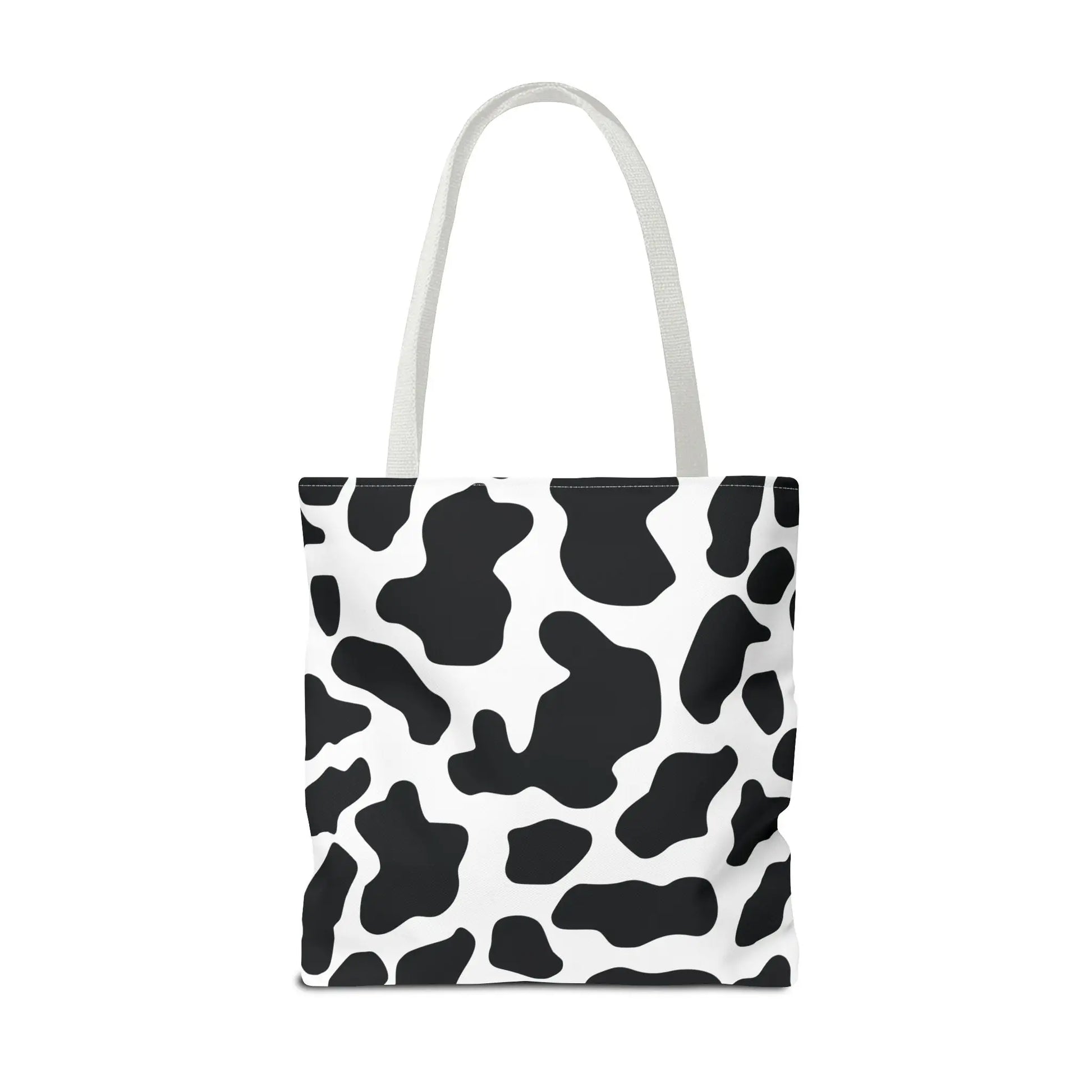 Large black and white cow print tote bag with matching handles reusable for shopping and travel use