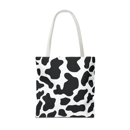 Large black and white cow print tote bag with matching handles reusable for shopping and travel use