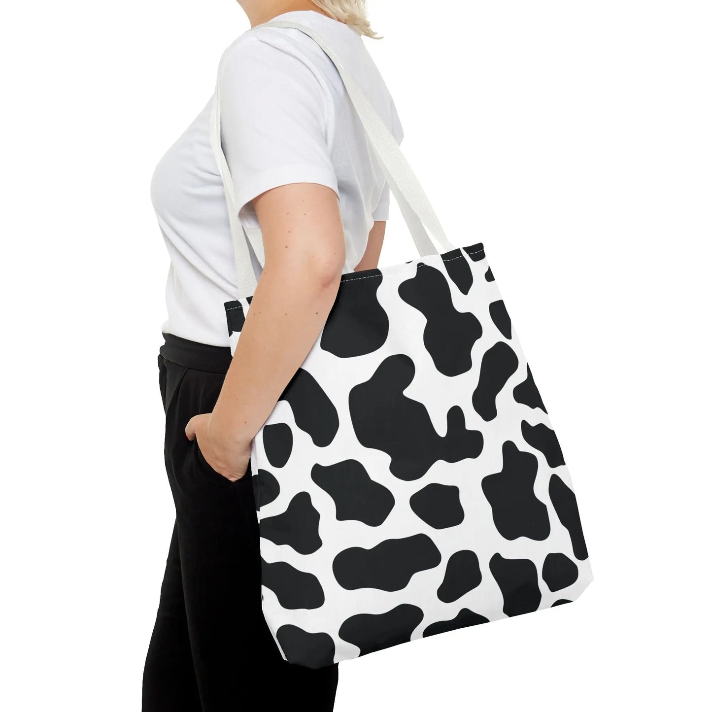 Large black and white cow print tote bag with single shoulder strap reusable for shopping and travel