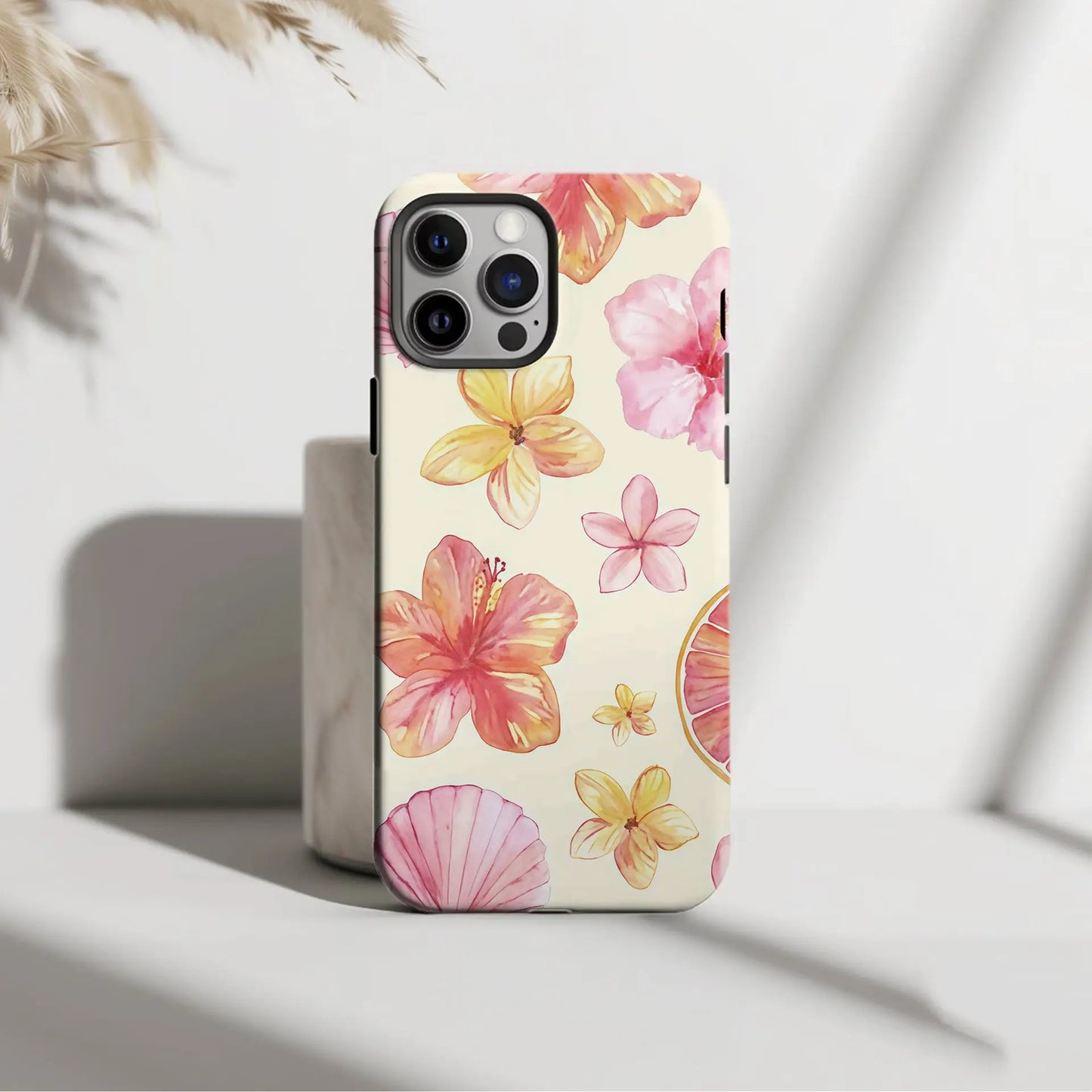 Pastel floral phone case cover for iPhone with watercolor pink yellow hibiscus flowers on creamy off-white background back view