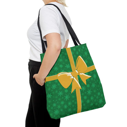 Green christmas tote bag with festive snowflake pattern, gold bow, black straps, eco-friendly reusable holiday carryall