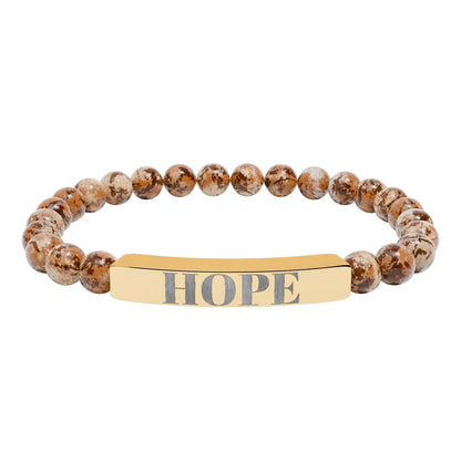 Gold-toned hope engraved natural stone stretch bracelet with earthy brown and beige speckled beads