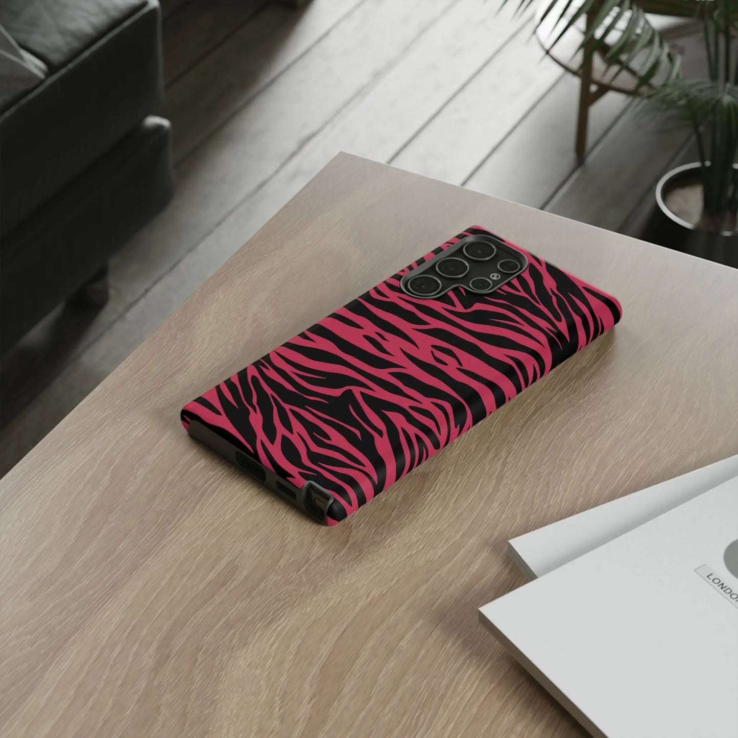 Magenta wild tiger phone case with vibrant pink and black wild tiger pattern print and sleek protective design back side view