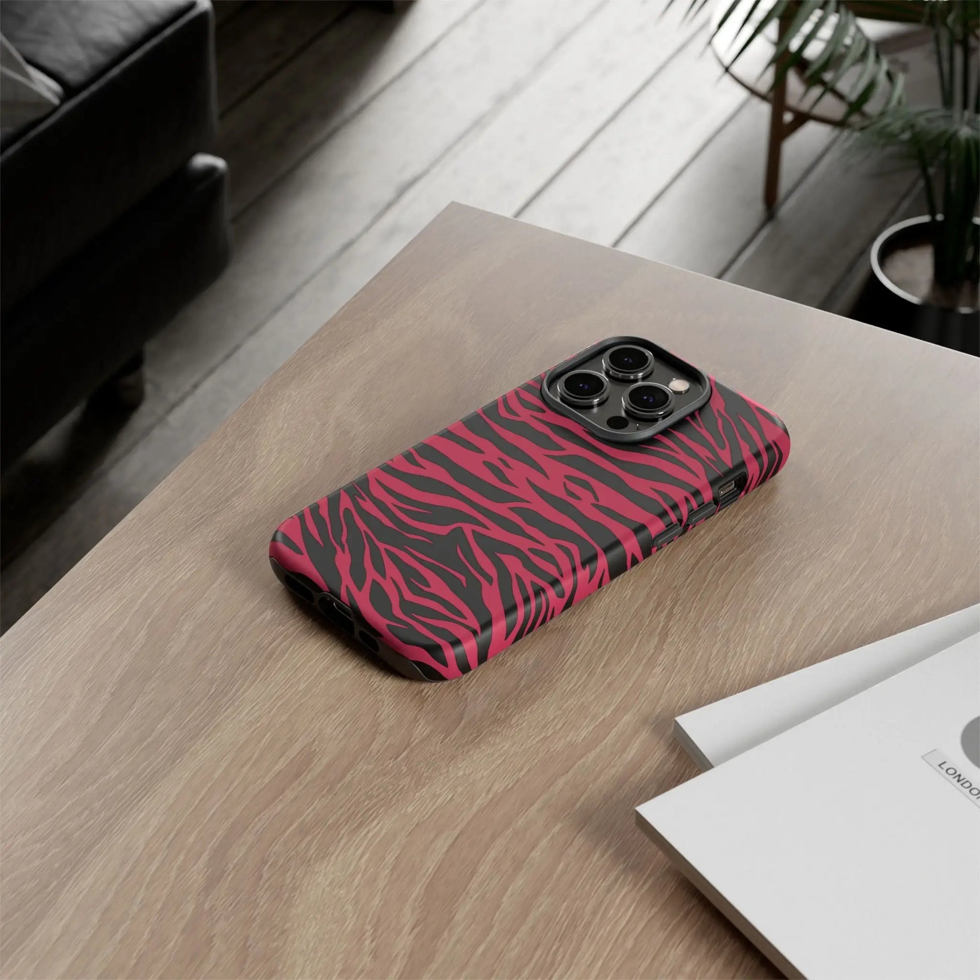 Magenta wild tiger phone case featuring a vibrant pink and black wild tiger pattern print on the back side with sleek protection