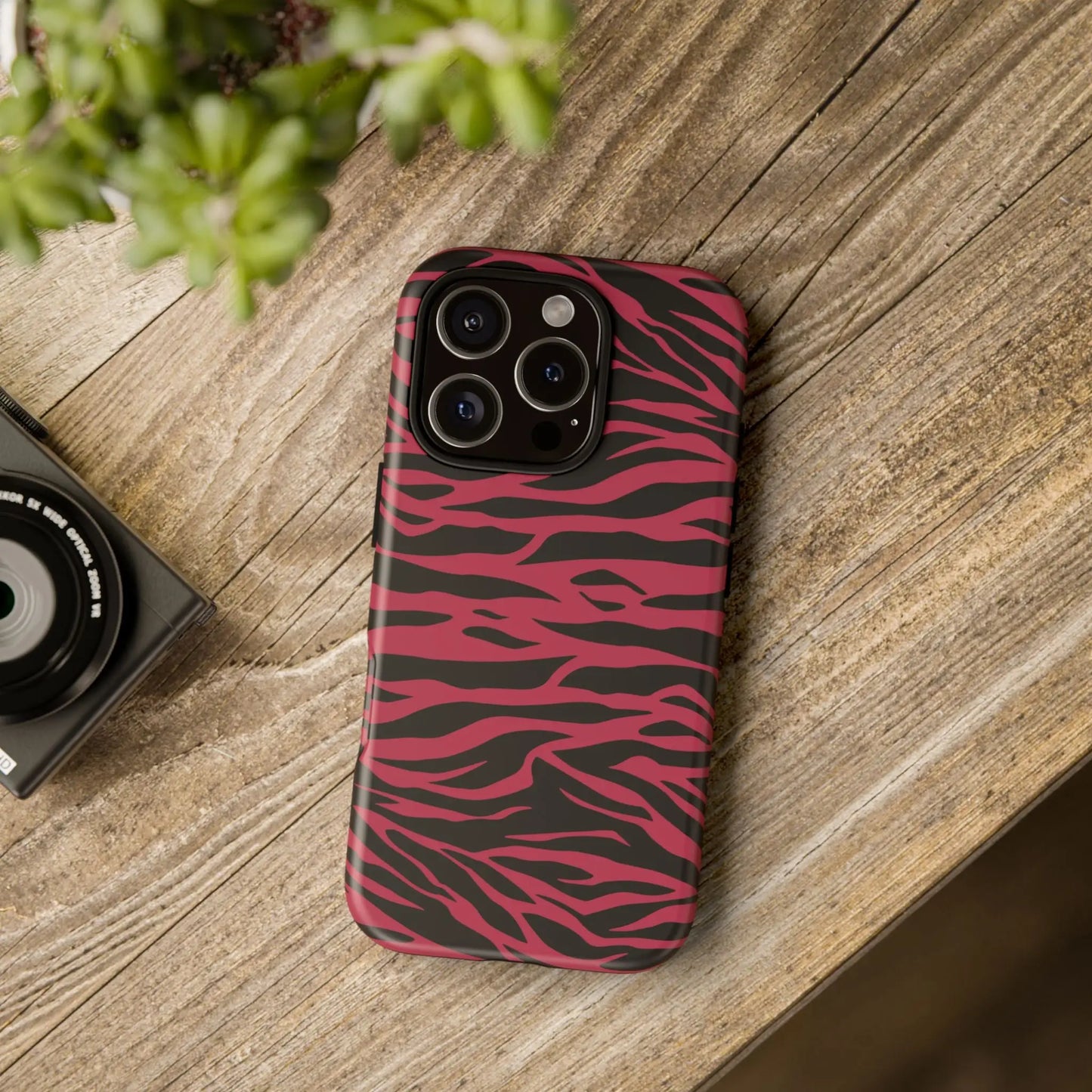 Magenta wild tiger phone case with vibrant pink and black zebra-striped tiger pattern print and sleek protective design back view