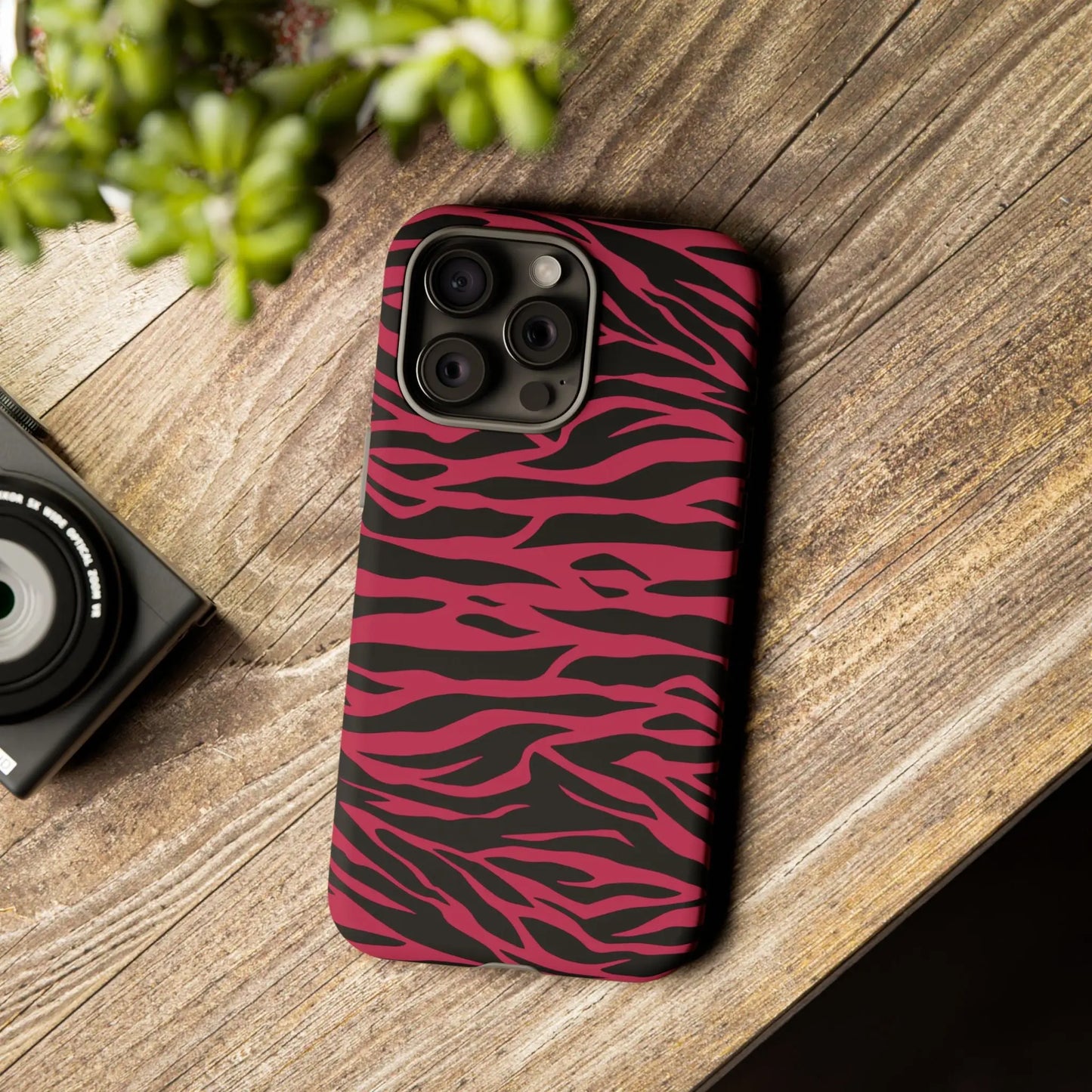 Magenta wild tiger phone case with a vibrant pink and black wild tiger pattern print and sleek protective design back view