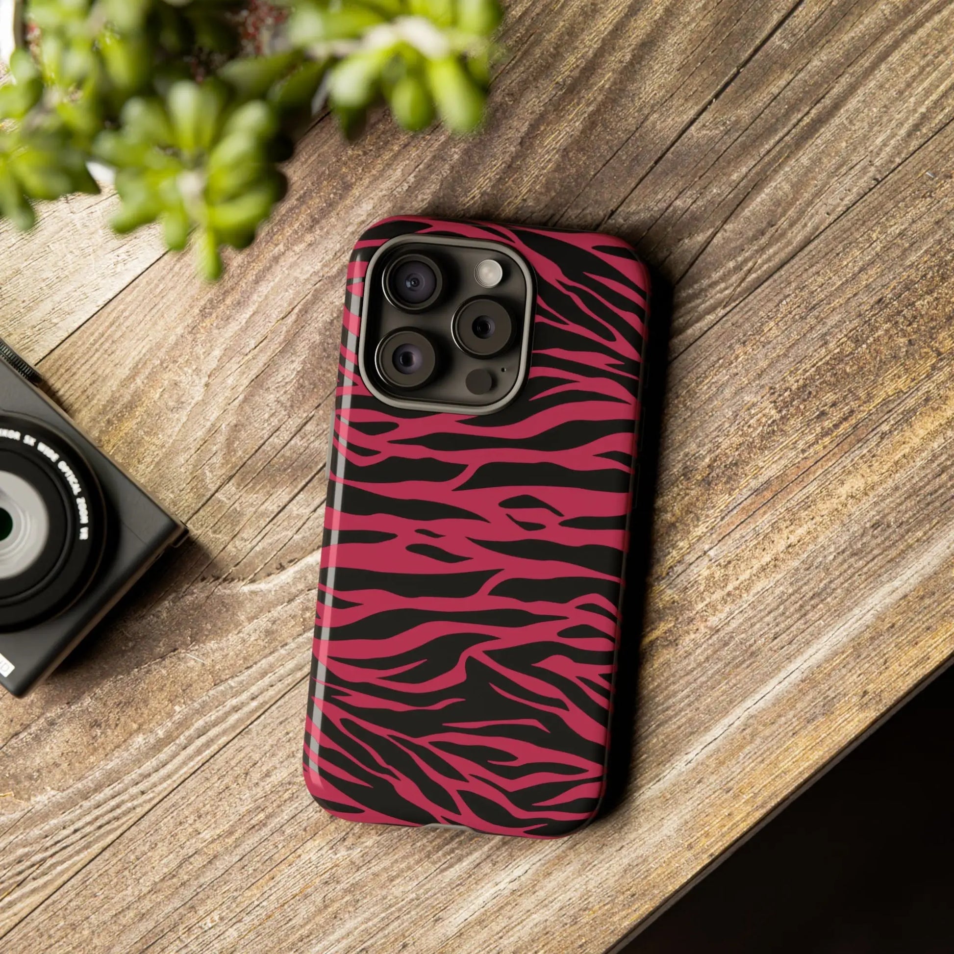 Magenta wild tiger phone case with vibrant pink and black wild tiger pattern print and sleek protective design back side