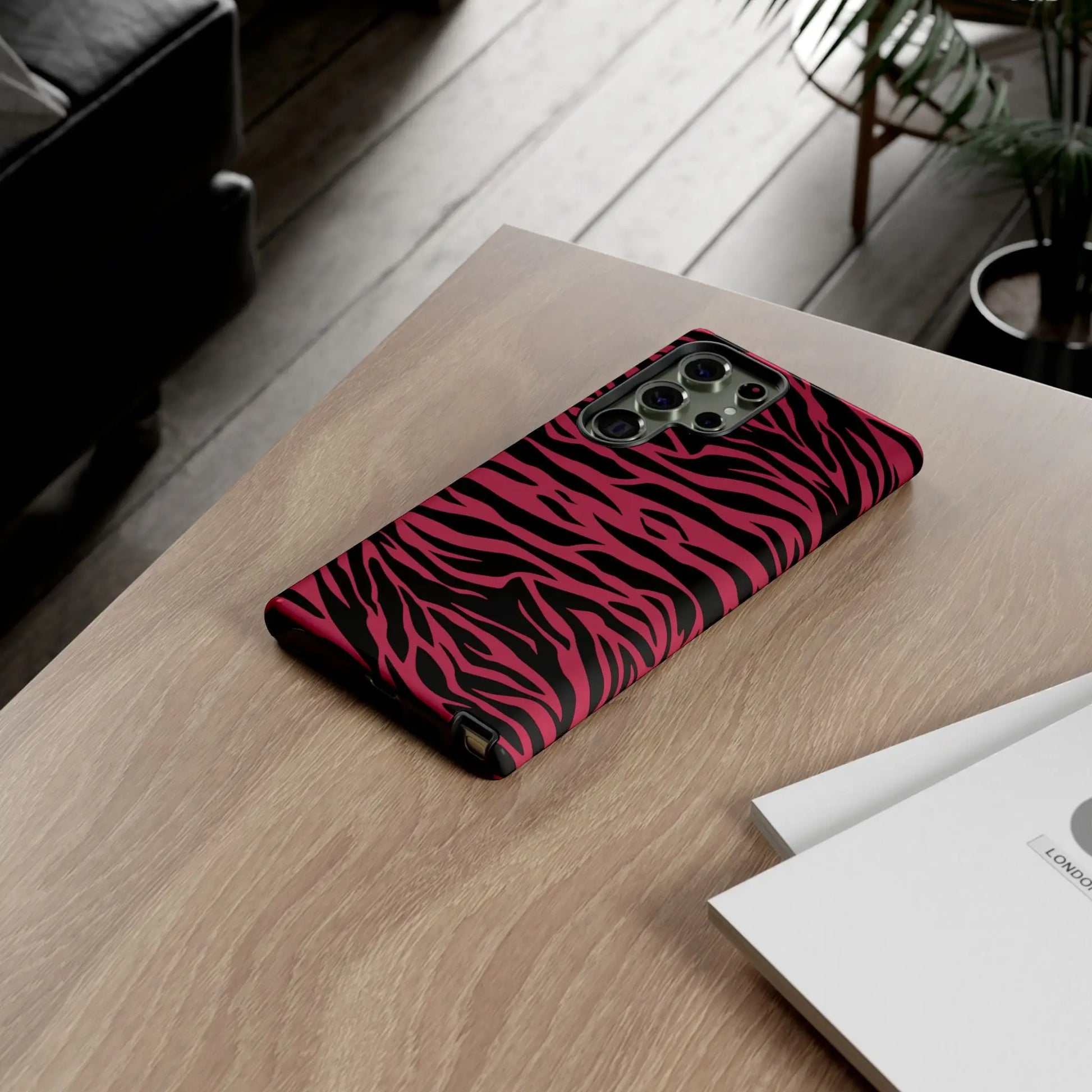 Magenta wild tiger phone case with vibrant pink and black wild tiger pattern print and sleek protective design showing back side