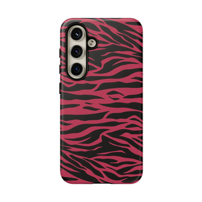 Back of a vibrant pink and black phone case with magenta wild tiger pattern print and glossy finish