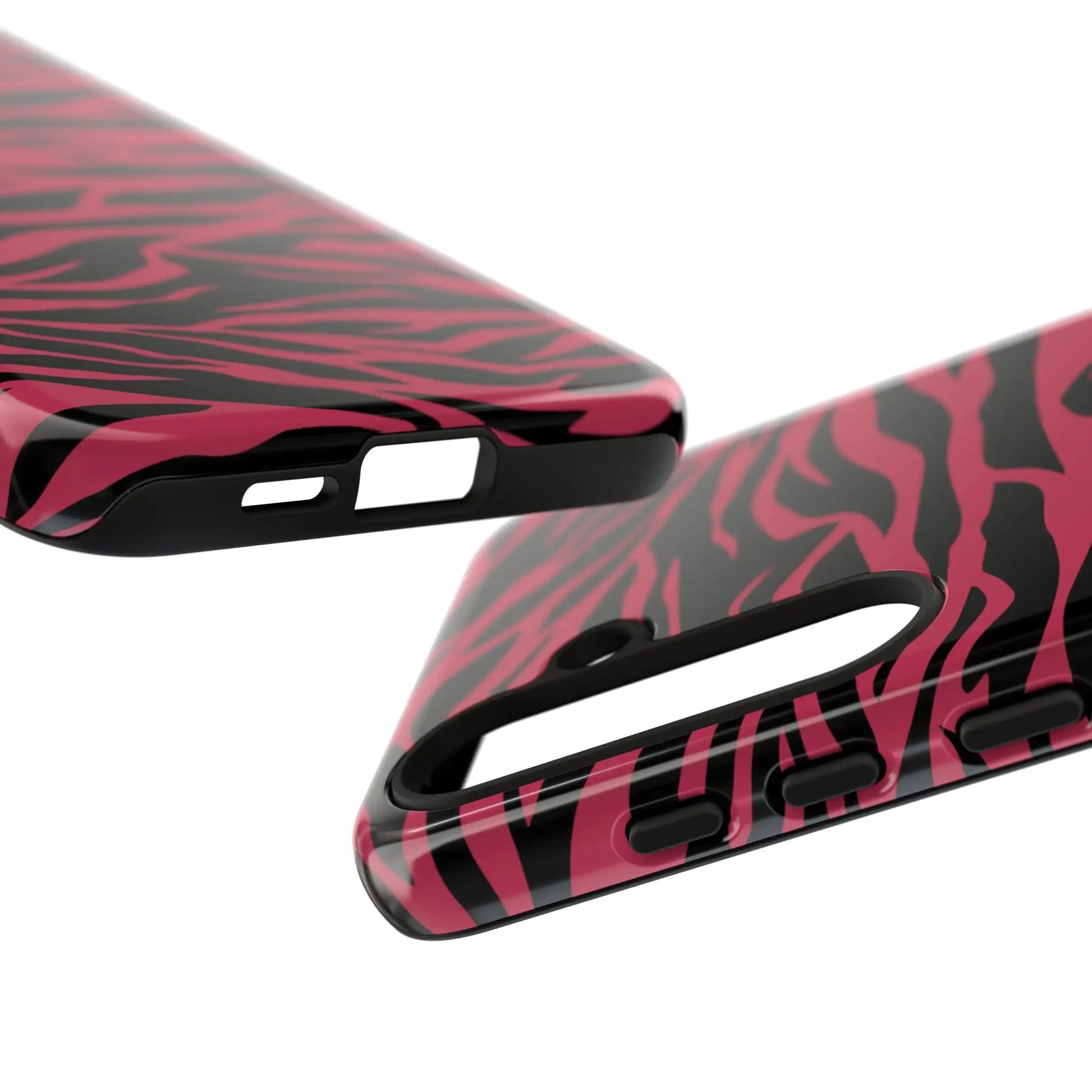 Back side of a magenta wild tiger pattern print phone case with pink and black zebra print and glossy finish