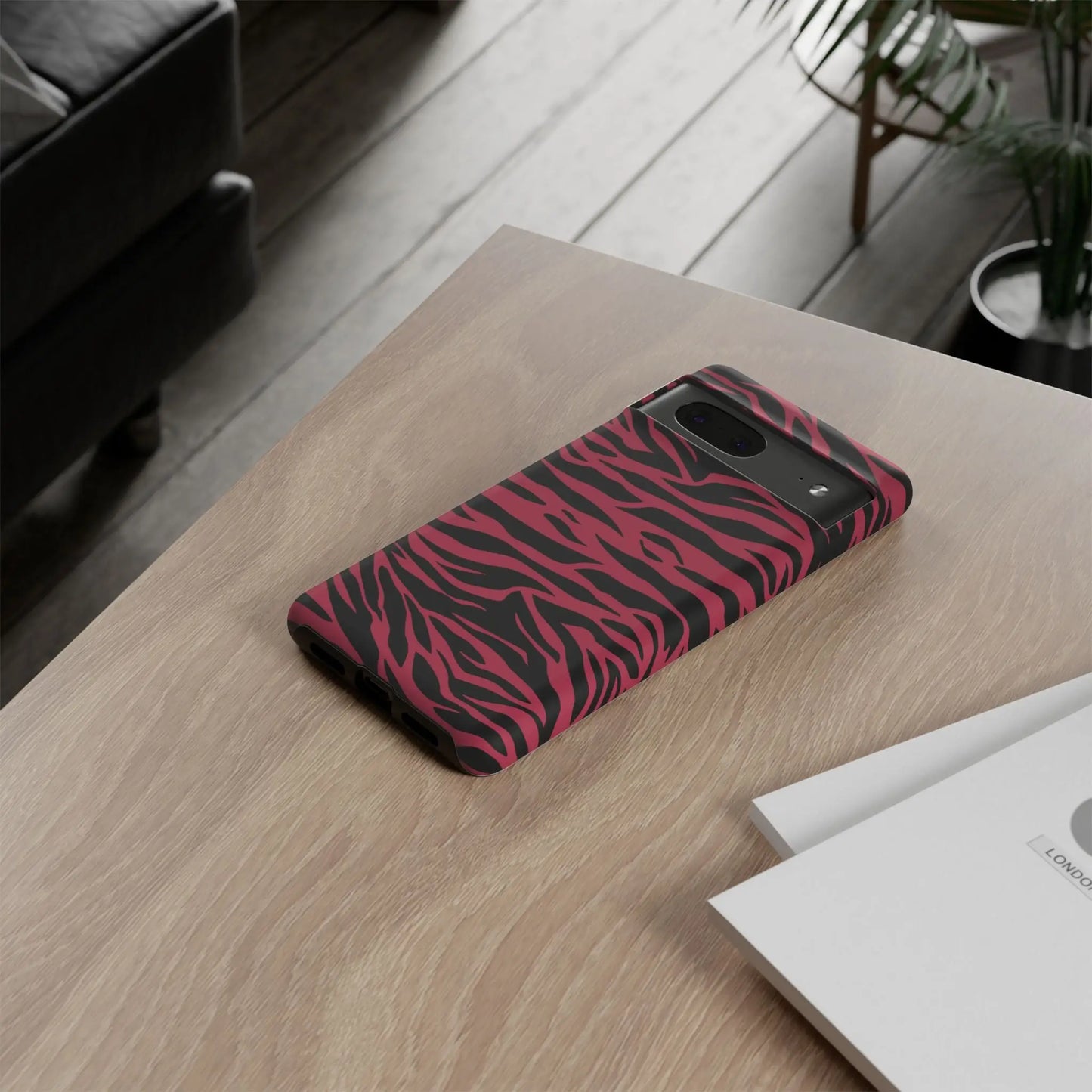 Magenta wild tiger pattern print phone case with vibrant pink and black zebra-striped protective back design