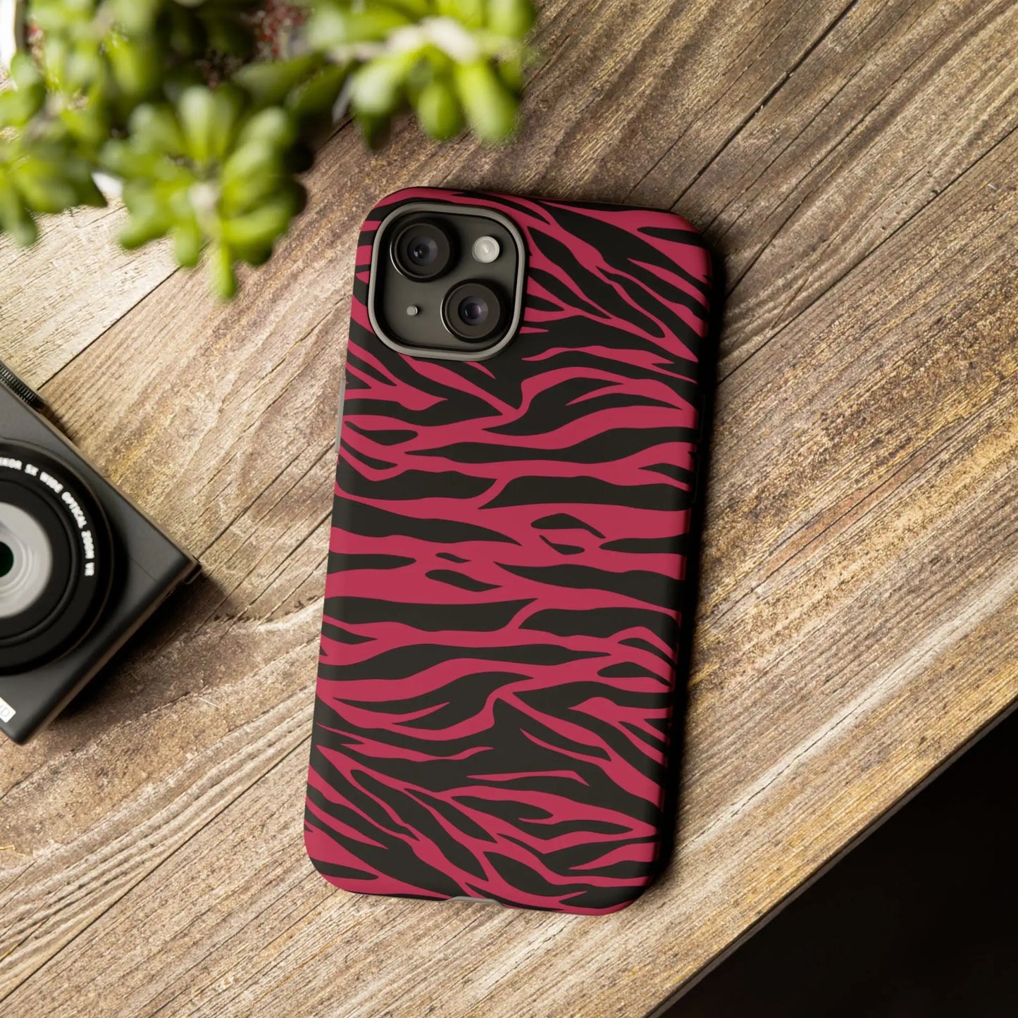 Magenta wild tiger pattern print phone case with vibrant pink and black zebra stripes and a sleek protective design back view