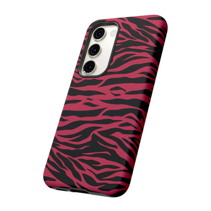 Back side of a vibrant pink and black glossy phone case with magenta wild tiger pattern print design