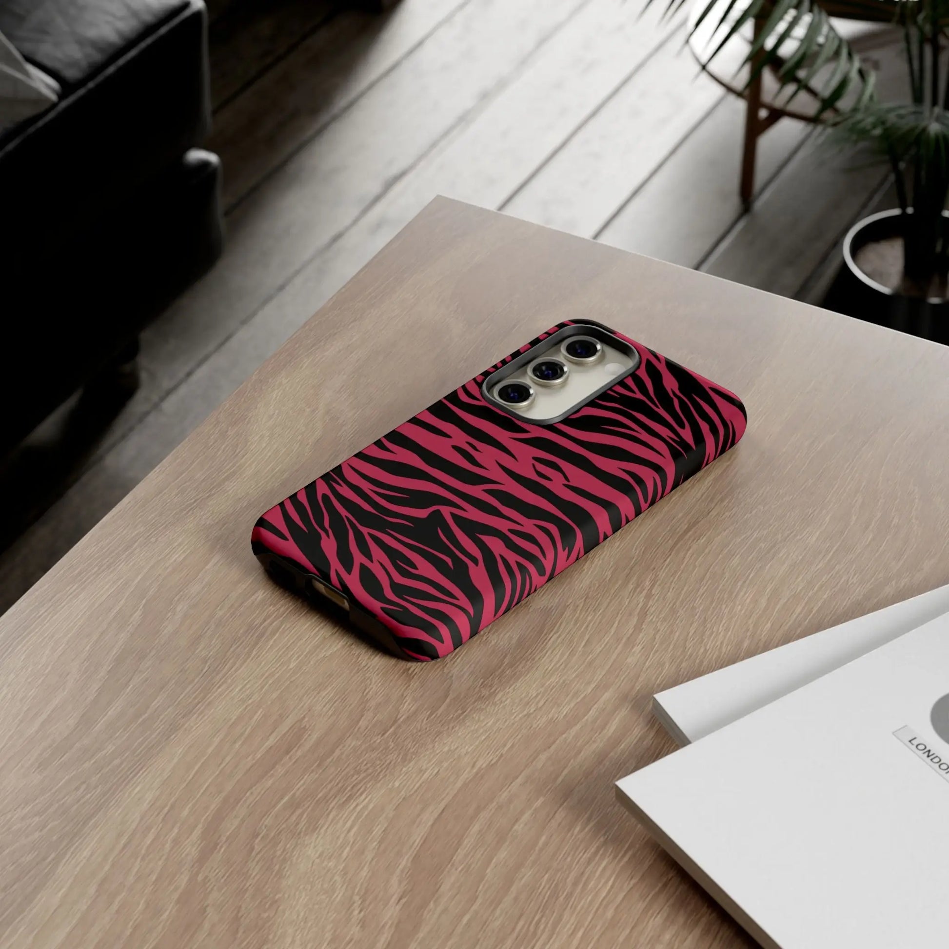 Magenta wild tiger phone case with vibrant pink and black glossy wild tiger pattern print on the back side